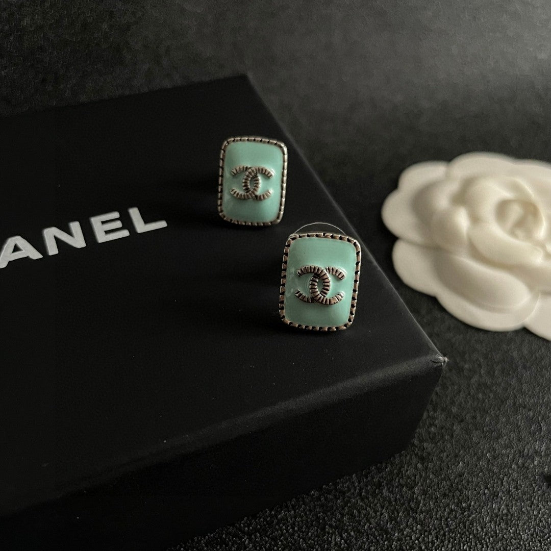 Double-C Emblem Stud Earrings in Polished Metal-Tone – Design 307 detail view
