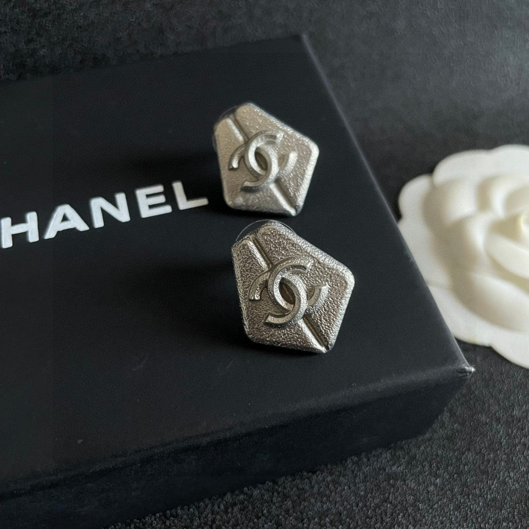 Double-C Emblem Stud Earrings in Polished Metal-Tone – Design 146 detail view
