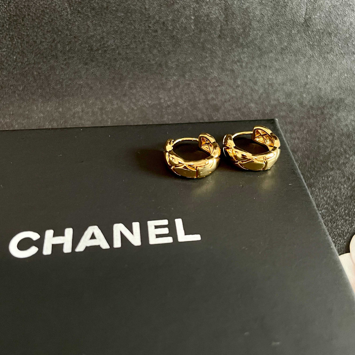 Double-C Emblem Stud Earrings in Polished Metal-Tone – Design 129 detail view