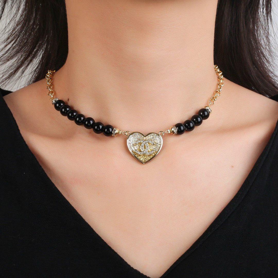 Double-C Emblem Pendant Necklace in Gold-Tone – Heart Detail front product view