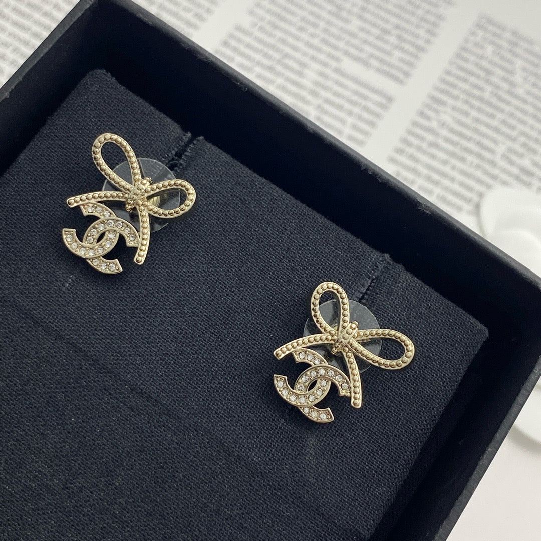 Double-C Emblem Stud Earrings in Polished Metal-Tone – Design 283 styled product view