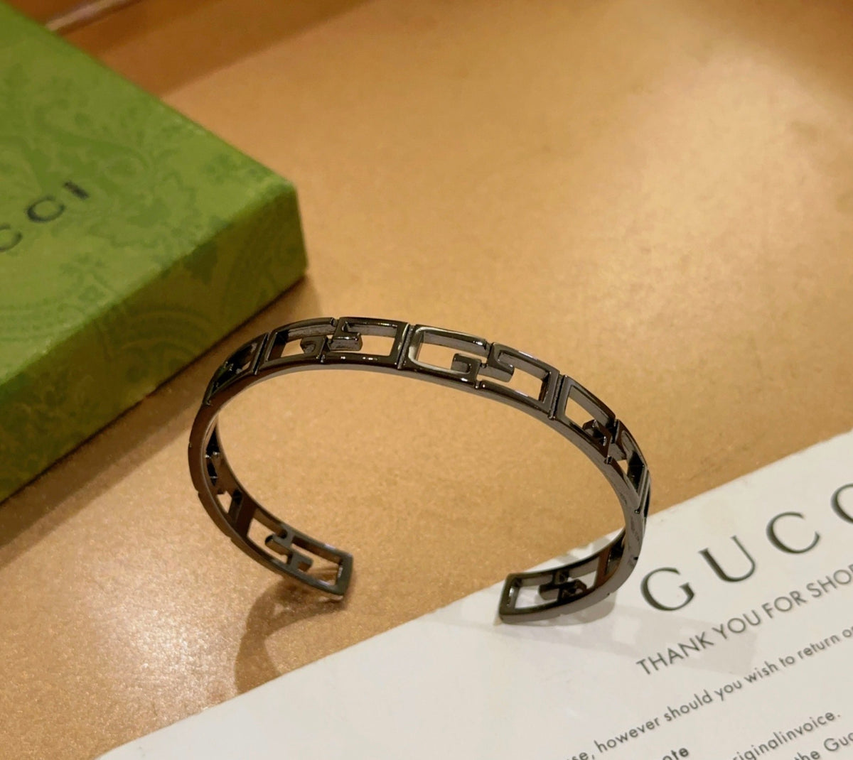Double-G Emblem Bangle in Polished Metal-Tone – Design 020 detail view