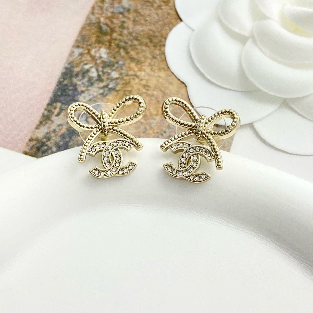 Double-C Emblem Stud Earrings in Polished Metal-Tone – Design 115 styled product view