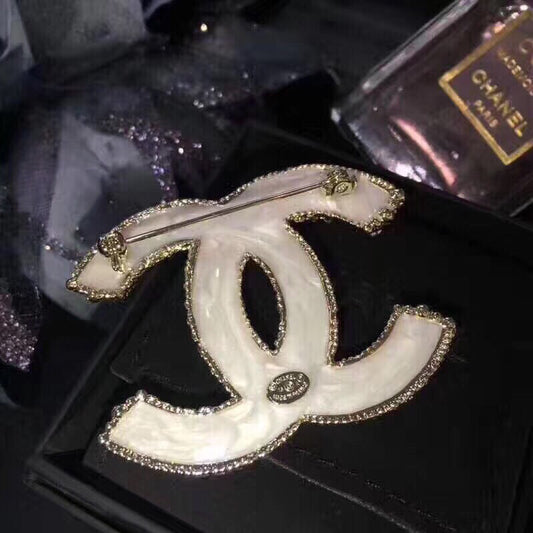 Signature Emblem Brooch in Polished Metal-Tone main product view