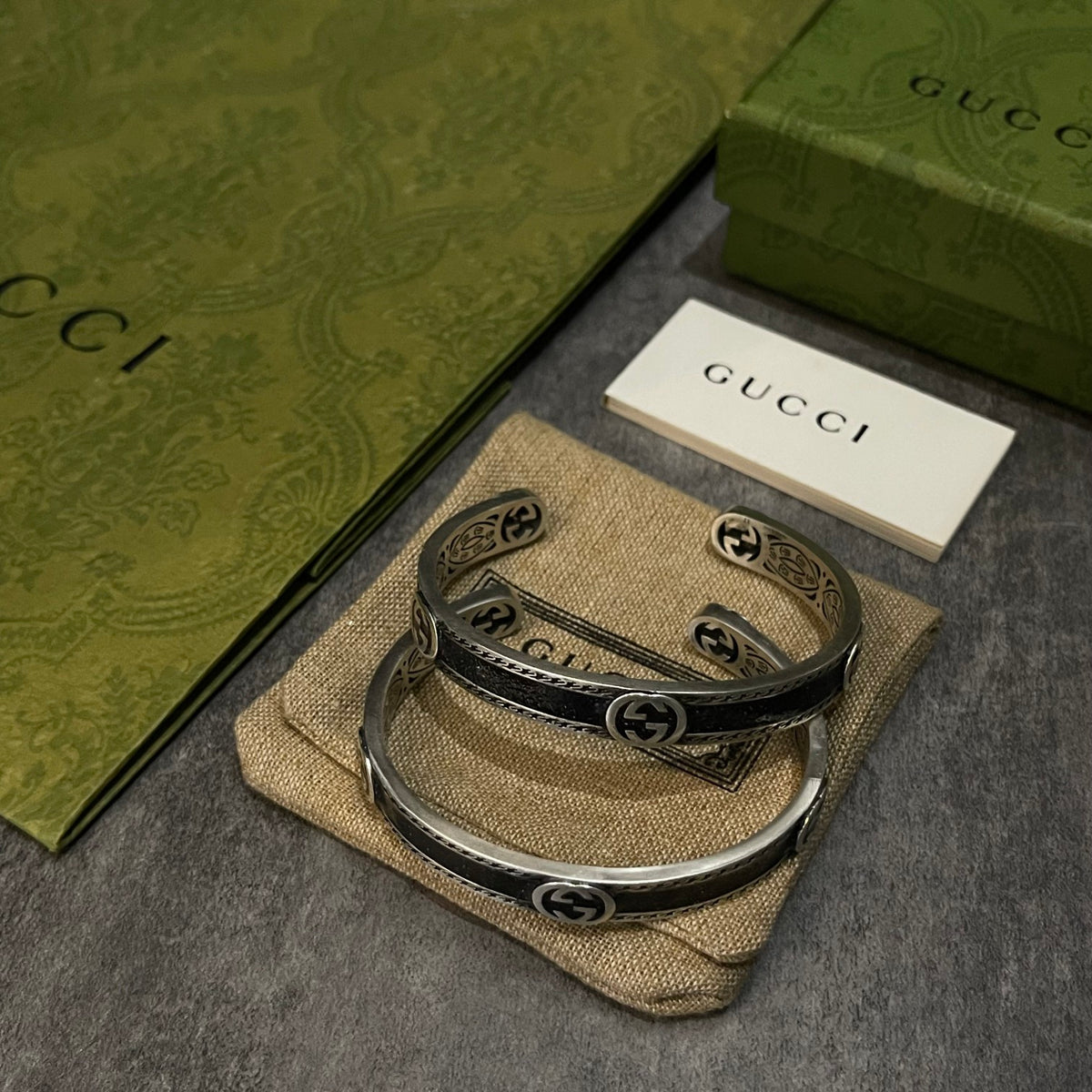 Double-G Emblem Bangle in Polished Metal-Tone – Vintage Detail front product view