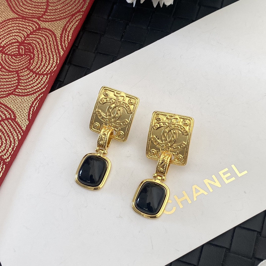 Letter Stud Earrings in Silver-Tone – Black Detail front product view