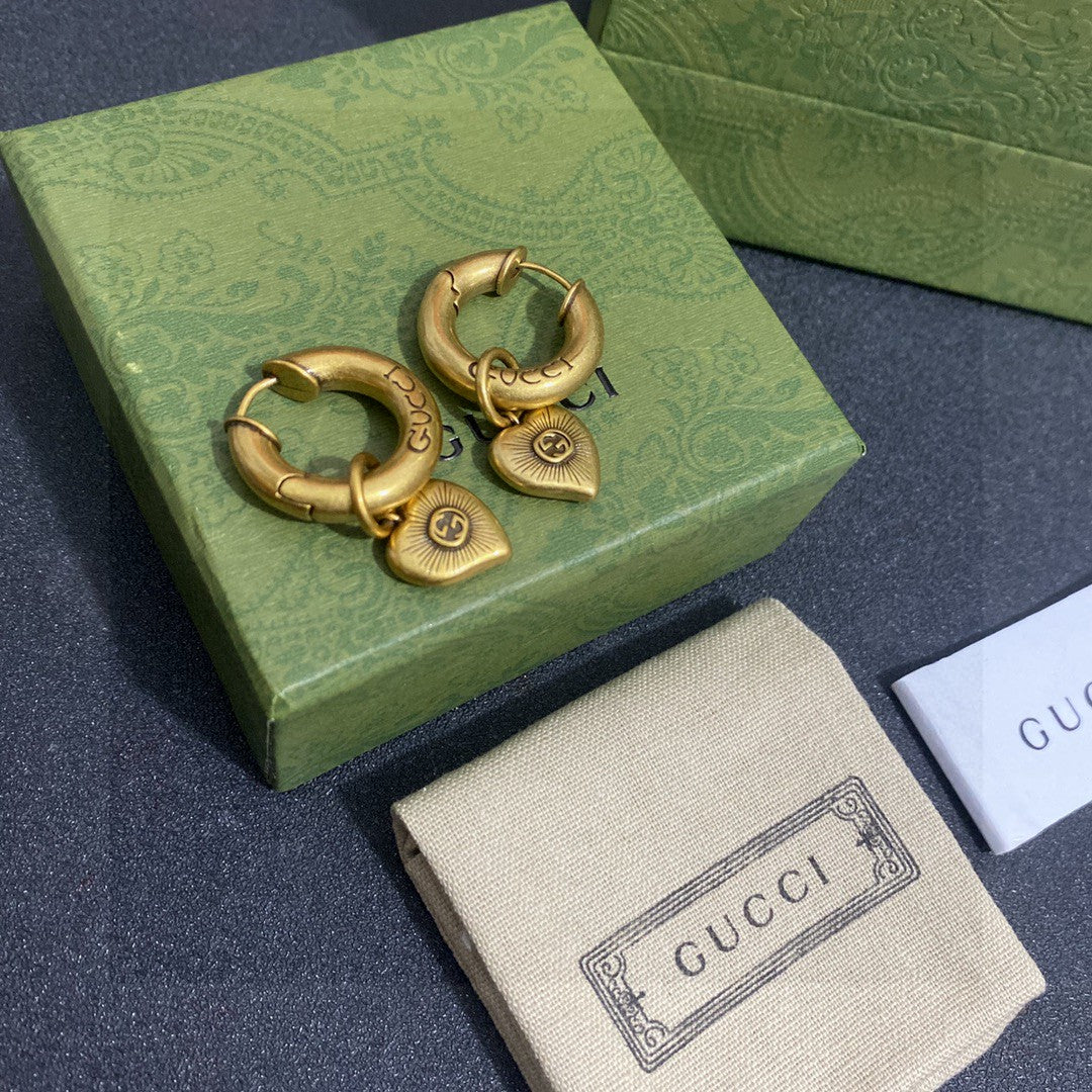 Letter Emblem Stud Earrings in Gold-Tone close-up detail