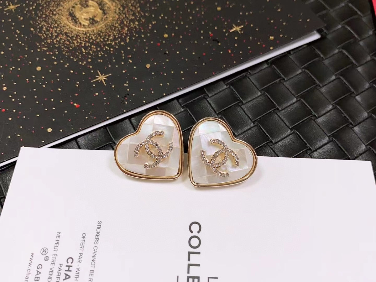 Double-C Emblem Stud Earrings in Polished Metal-Tone – Design 467 close-up detail