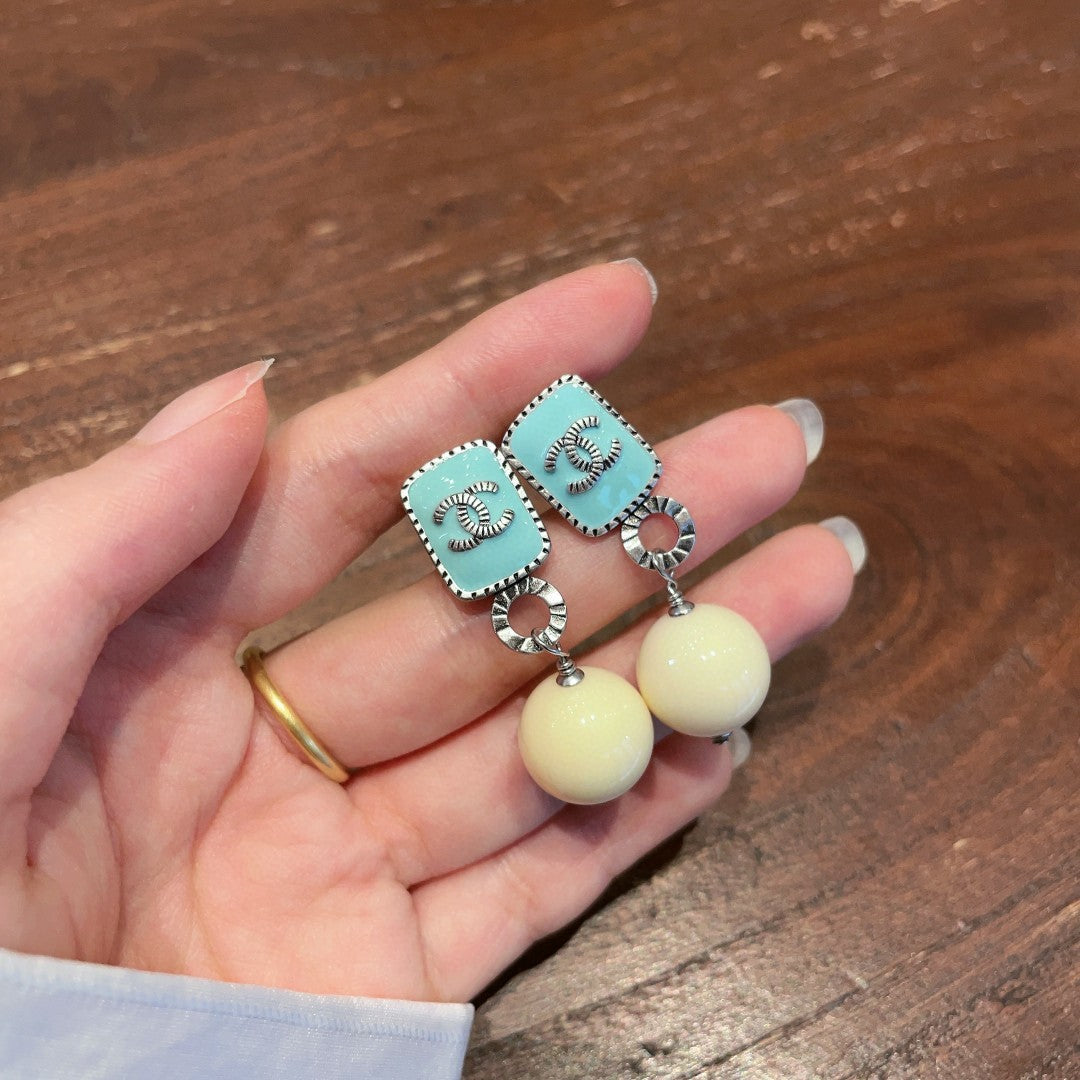 Double-C Emblem Pearl-Detail Statement Earrings – Pearl Detail – Design 030 close-up detail