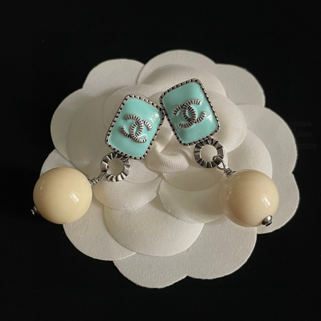 Double-C Emblem Pearl-Detail Statement Earrings – Pearl Detail – Design 030 detail view