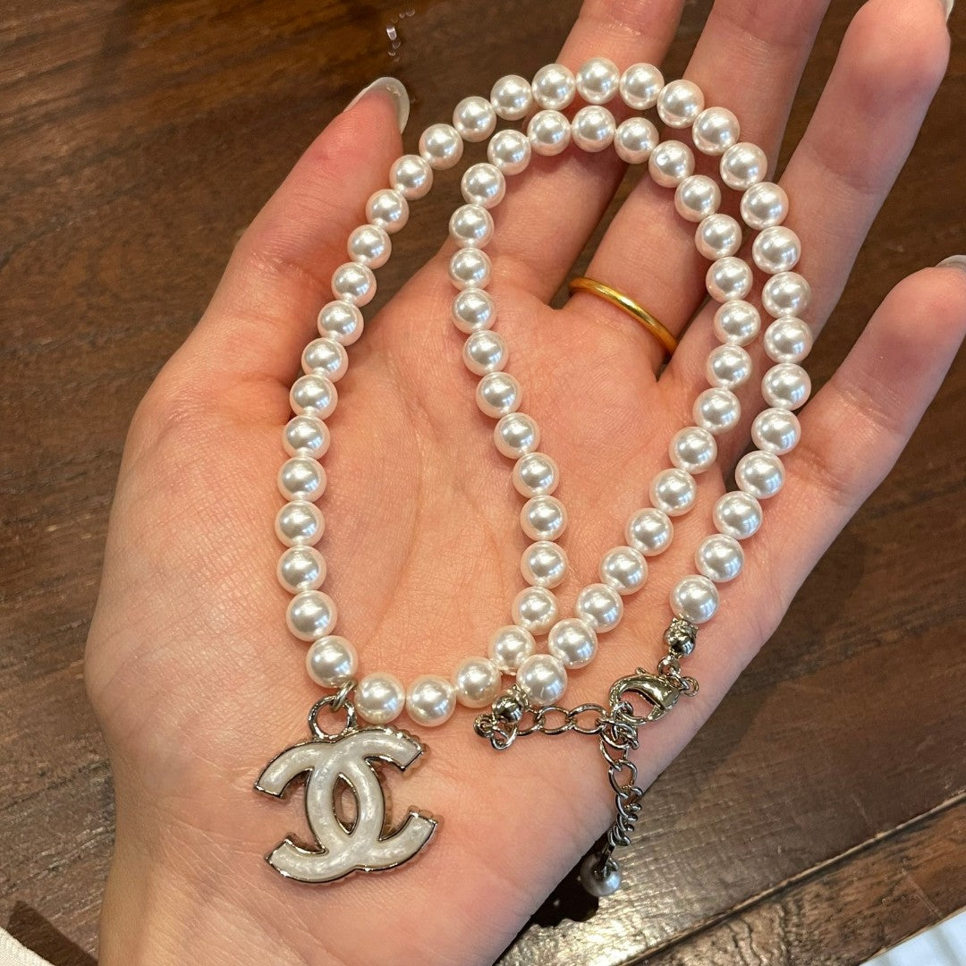 Double-C Emblem Pearl-Detail Pendant Necklace – Pearl Detail – Design 123 detail view