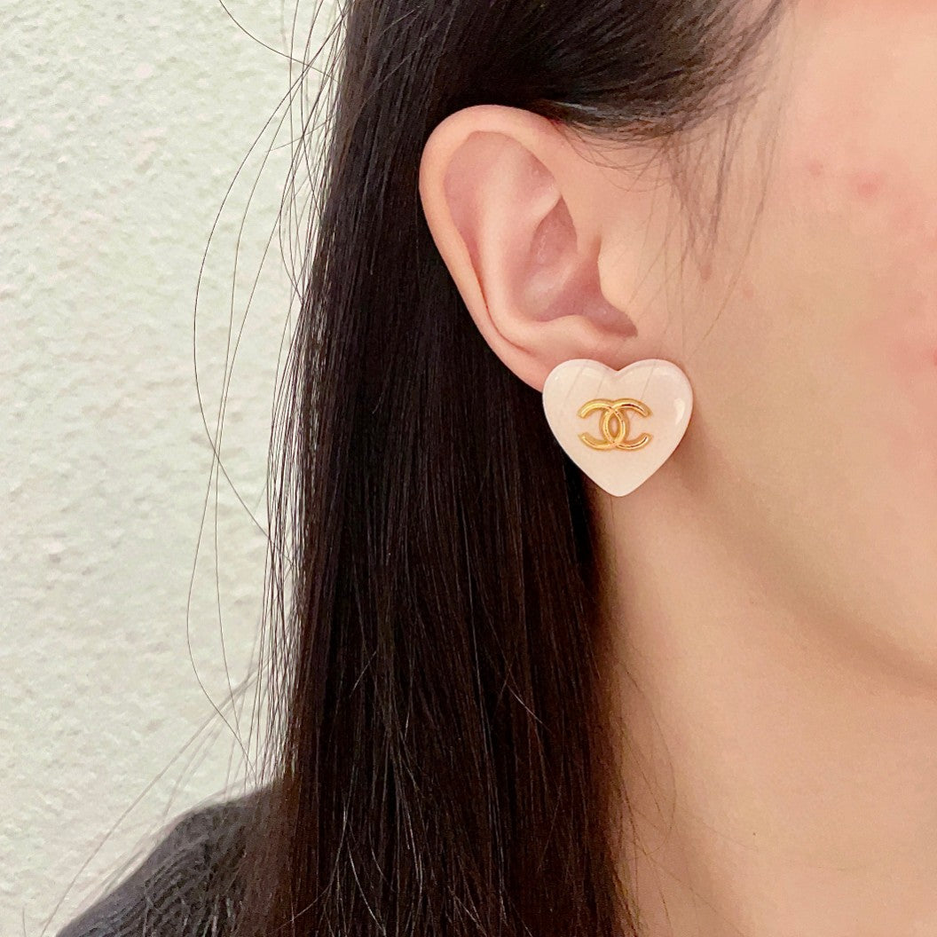 Double-C Emblem Stud Earrings in Polished Metal-Tone – Heart Detail – Design 015 detail view