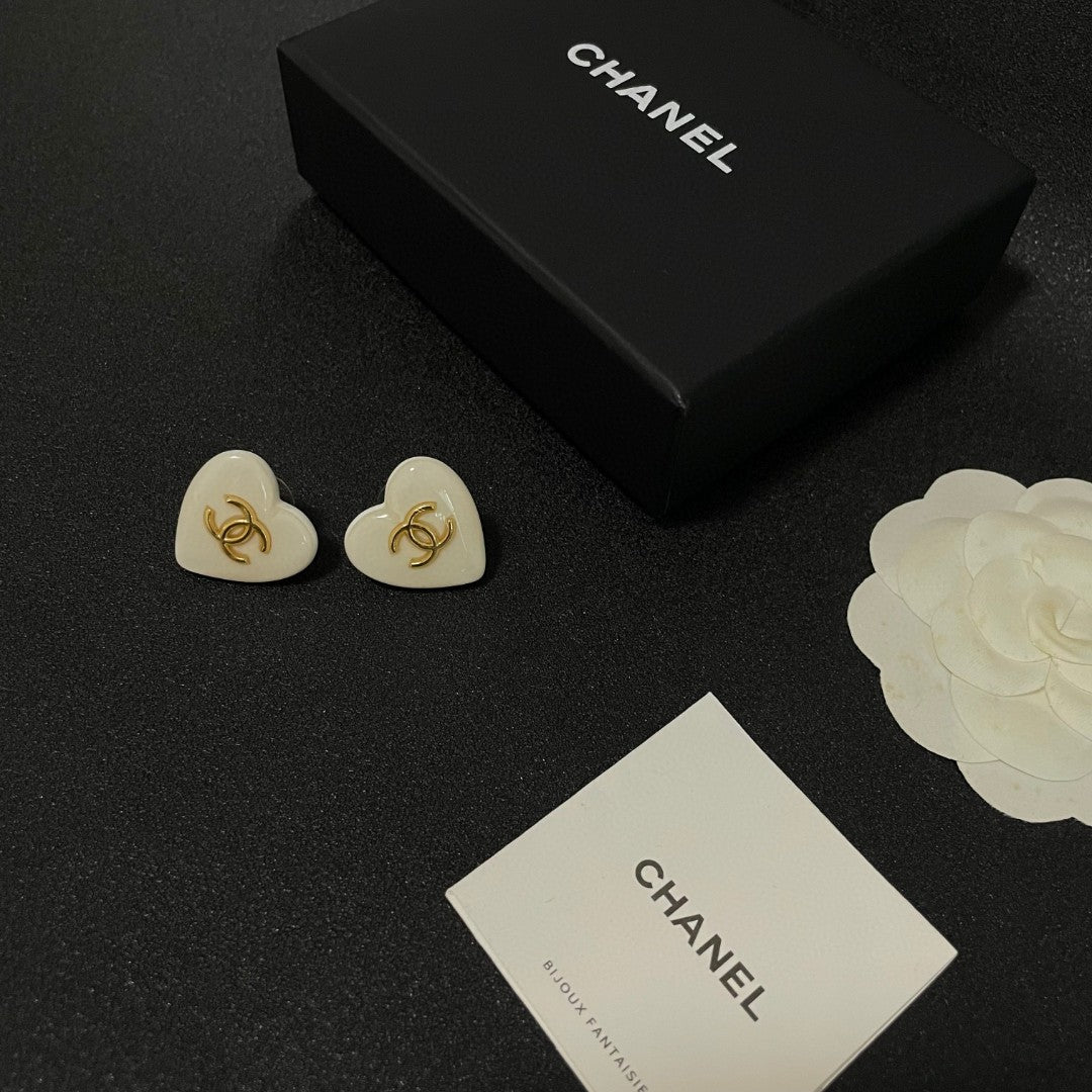 Double-C Emblem Stud Earrings in Polished Metal-Tone – Heart Detail – Design 015 close-up detail