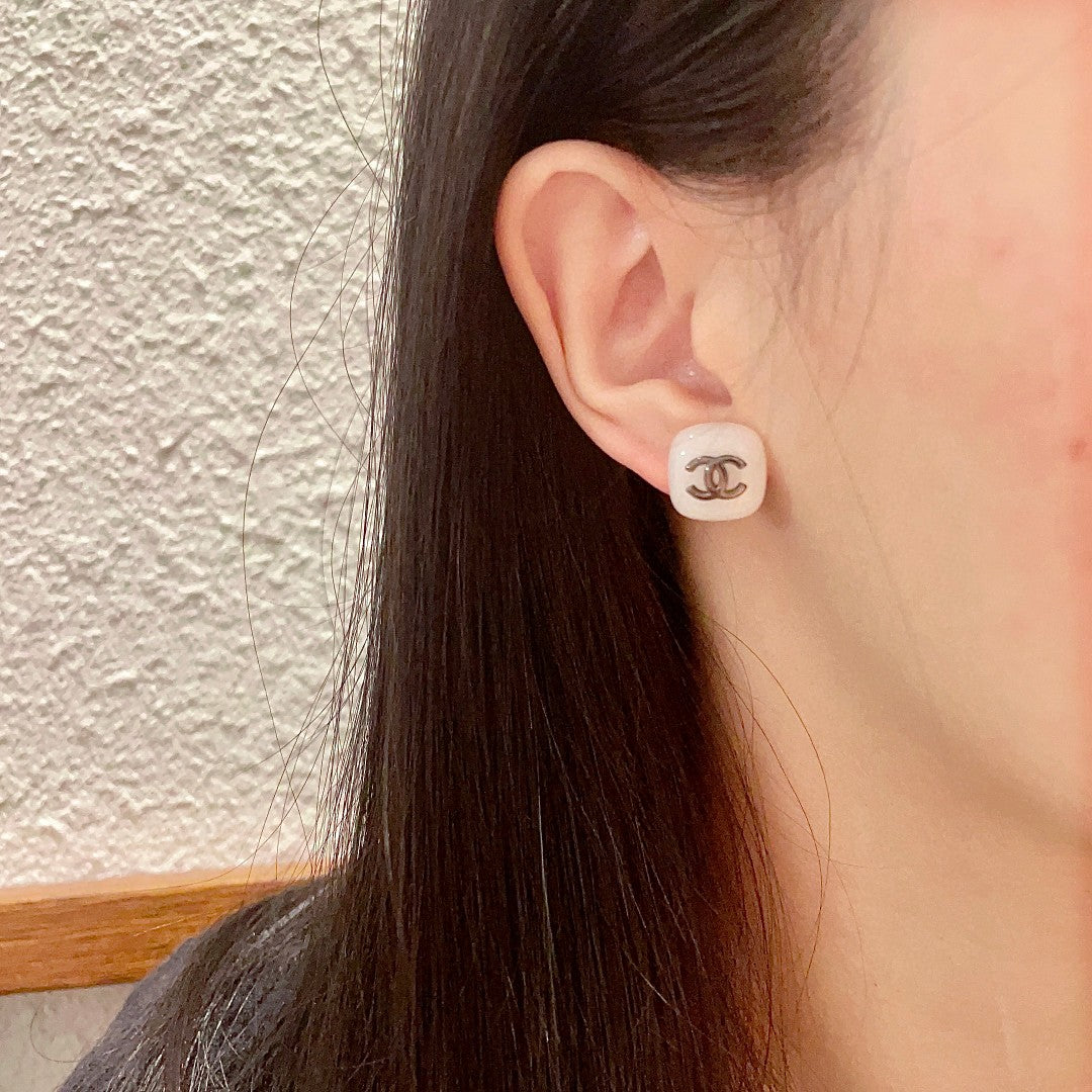 Double-C Emblem Stud Earrings in Polished Metal-Tone – Design 364 detail view