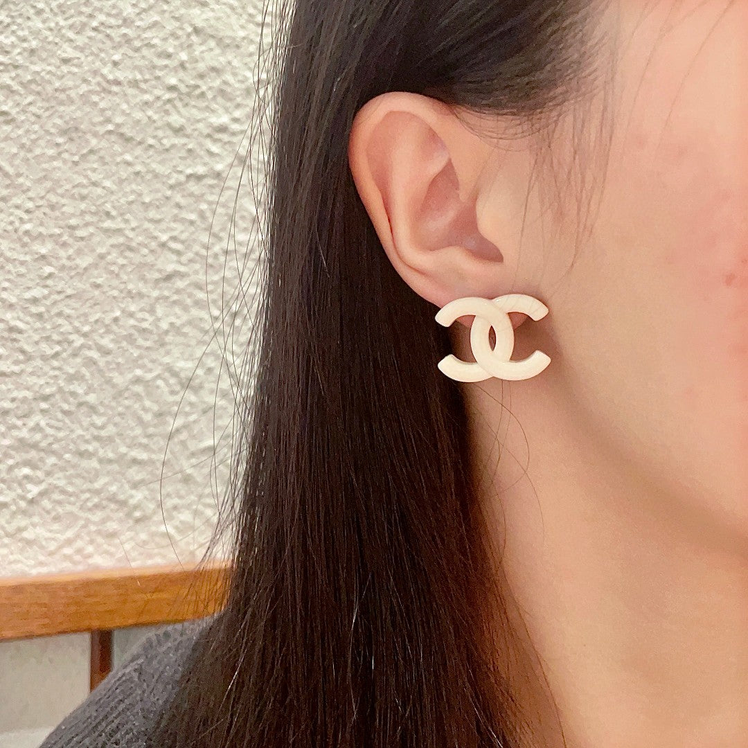 Double-C Emblem Stud Earrings in Polished Metal-Tone – Design 363 detail view