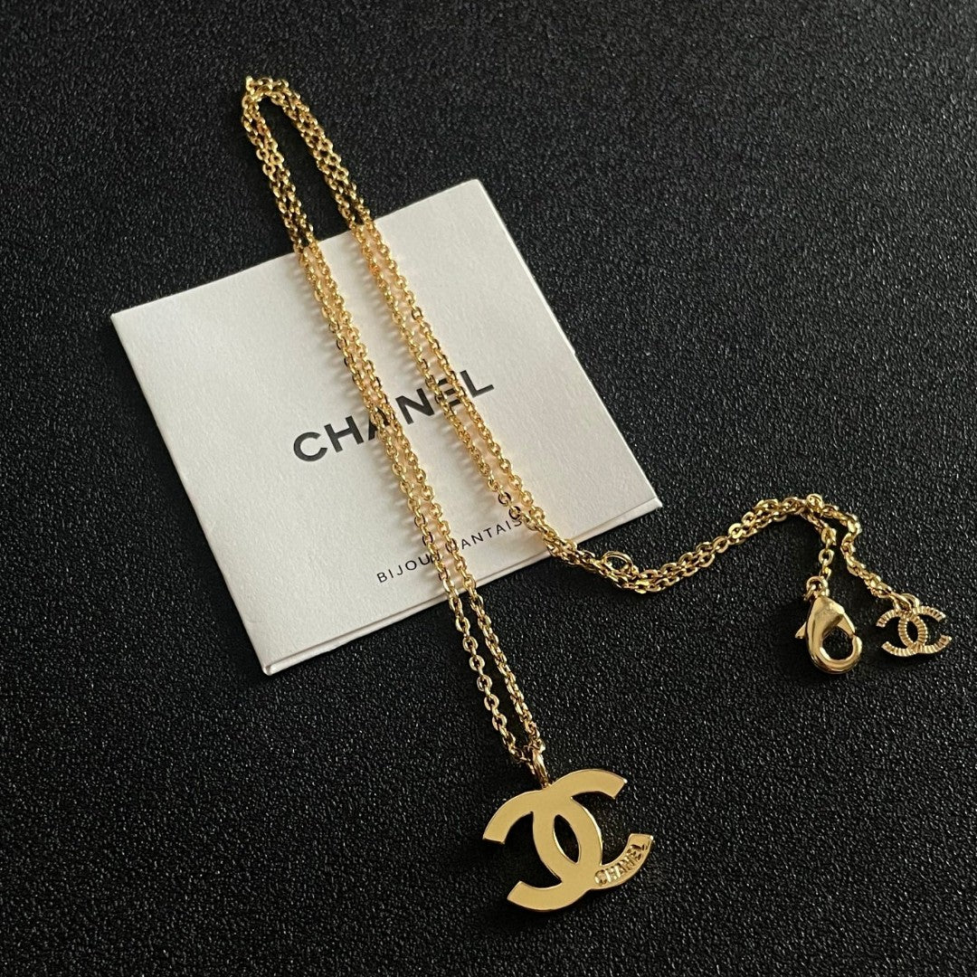 Double-C Emblem Pendant Necklace in Polished Metal-Tone – Design 058 detail view