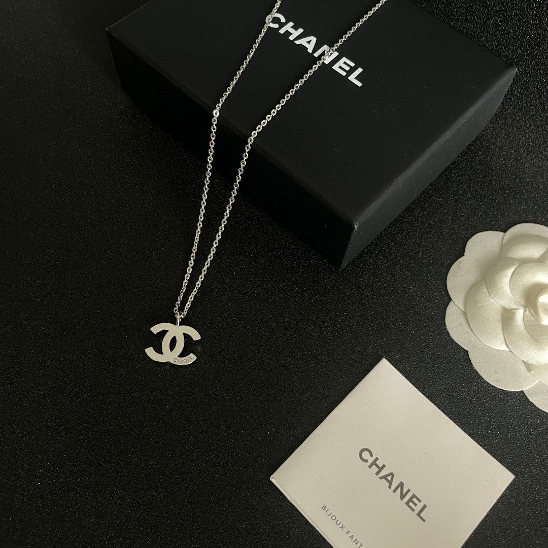 Double-C Emblem Pendant Necklace in Polished Metal-Tone – Design 057 close-up detail