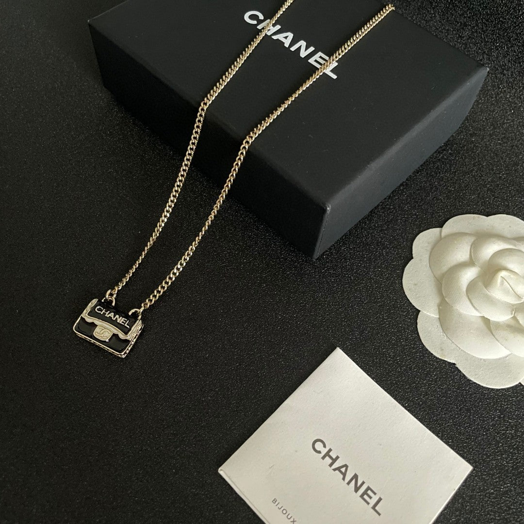 Double-C Emblem Pendant Necklace in Polished Metal-Tone – Design 056 front product view