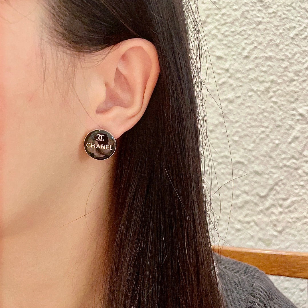 Double-C Emblem Stud Earrings in Polished Metal-Tone – Design 347 detail view