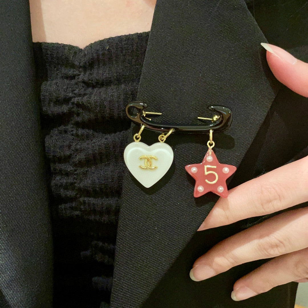 Double-C Emblem Brooch in Polished Metal-Tone – Star Detail main product view