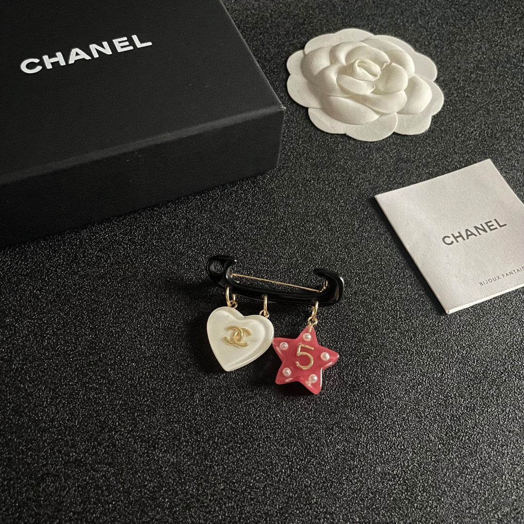 Double-C Emblem Brooch in Polished Metal-Tone – Star Detail styled product view