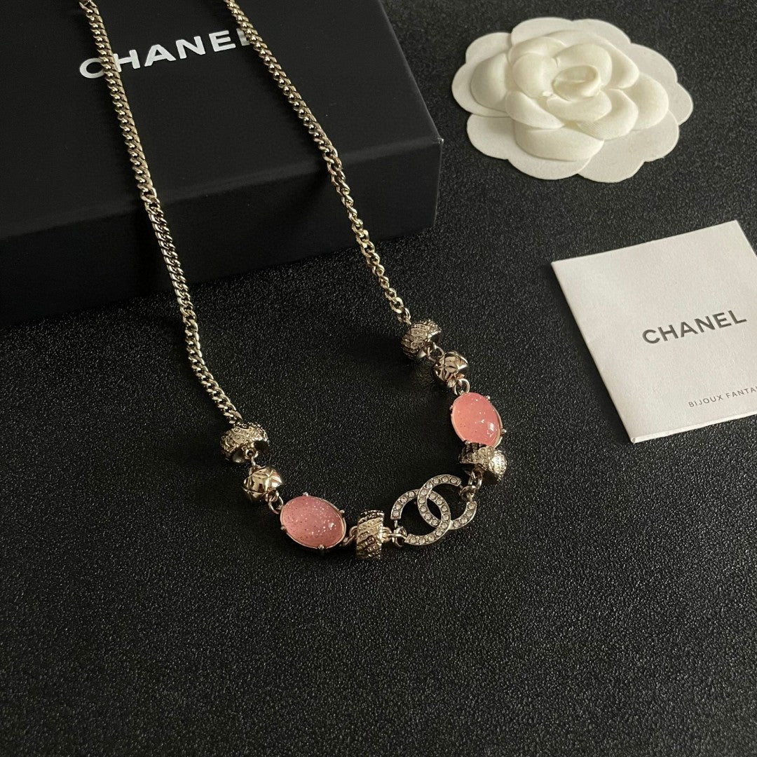 Double-C Emblem Pendant Necklace in Polished Metal-Tone – Pink Detail front product view