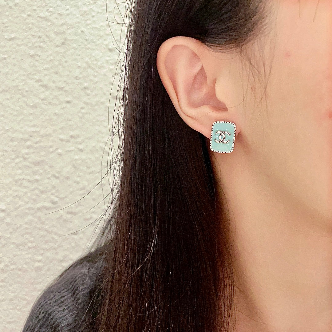 Double-C Emblem Stud Earrings in Polished Metal-Tone – Design 307 detail view
