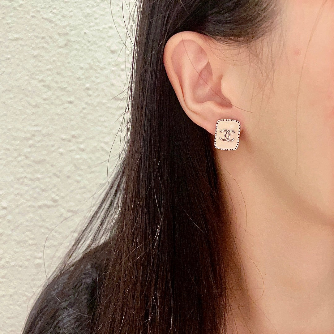 Double-C Emblem Stud Earrings in Polished Metal-Tone – Design 308 detail view