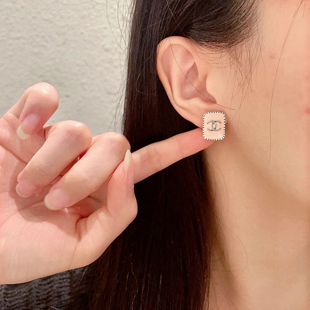 Double-C Emblem Stud Earrings in Polished Metal-Tone – Design 308 front product view