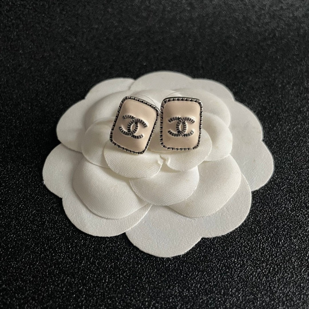 Double-C Emblem Stud Earrings in Polished Metal-Tone – Design 308 front product view