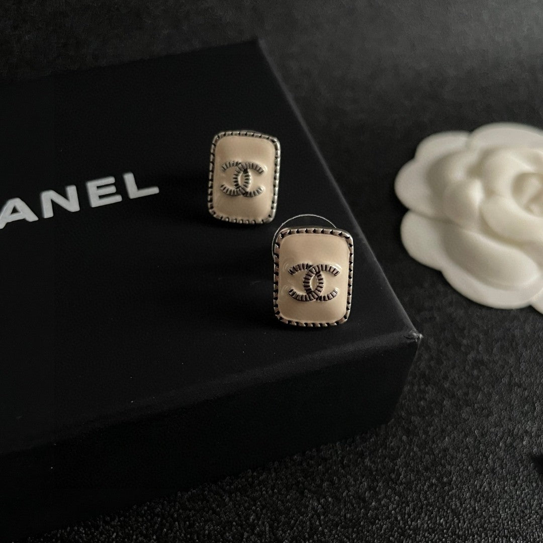 Double-C Emblem Stud Earrings in Polished Metal-Tone – Design 308 detail view