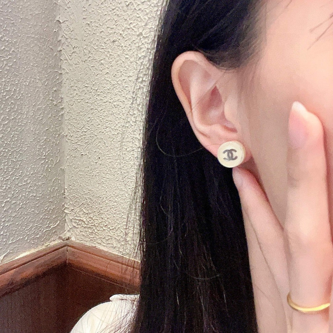 Double-C Emblem Stud Earrings in Polished Metal-Tone – Design 297 detail view
