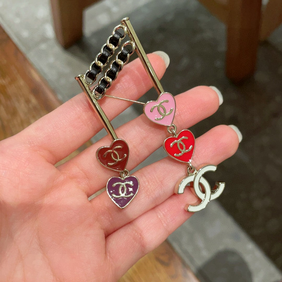 Double-C Emblem Brooch in Polished Metal-Tone – Heart Detail side detail