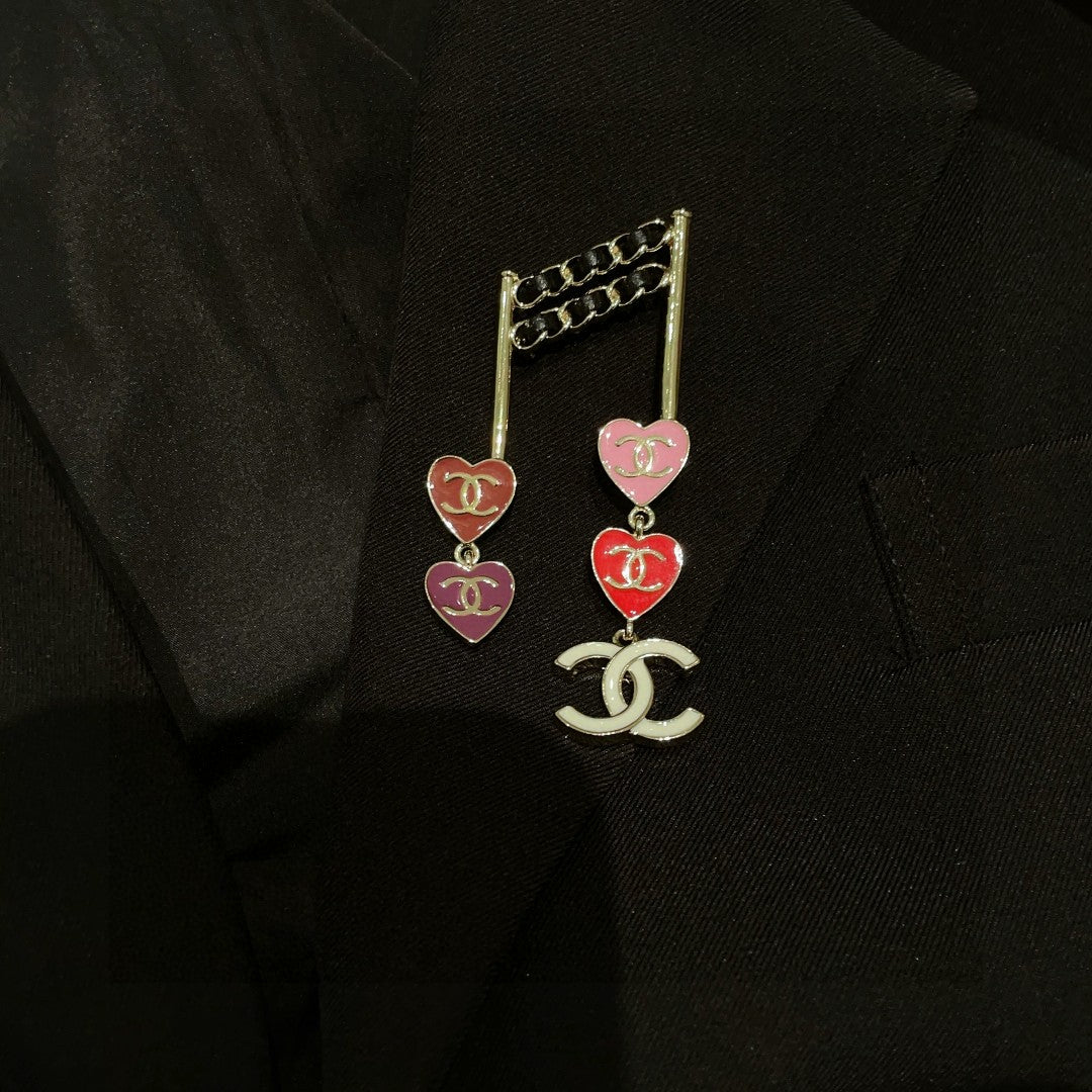 Double-C Emblem Brooch in Polished Metal-Tone – Heart Detail front product view