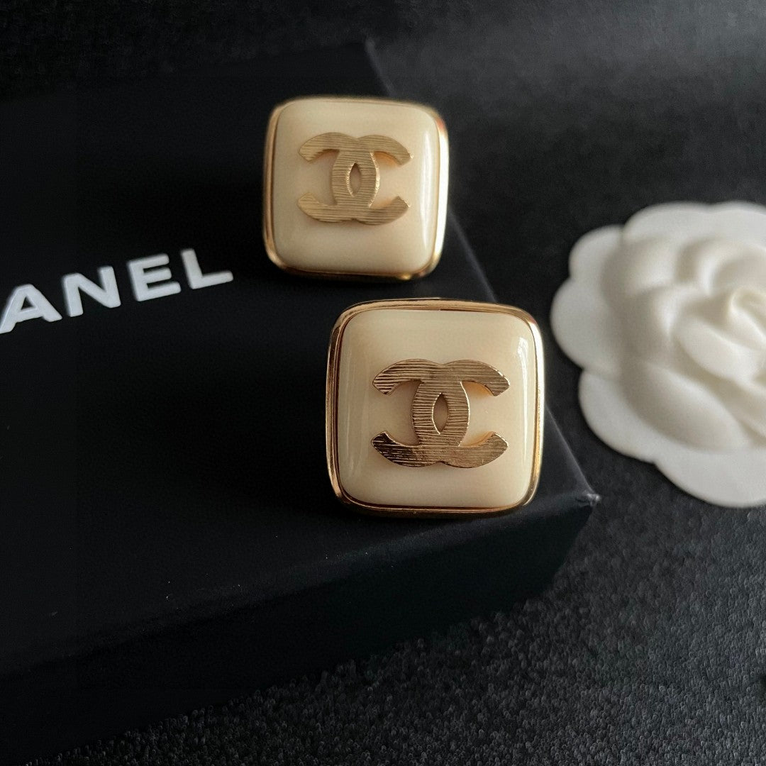 Double-C Emblem Stud Earrings in Polished Metal-Tone – Design 294 detail view