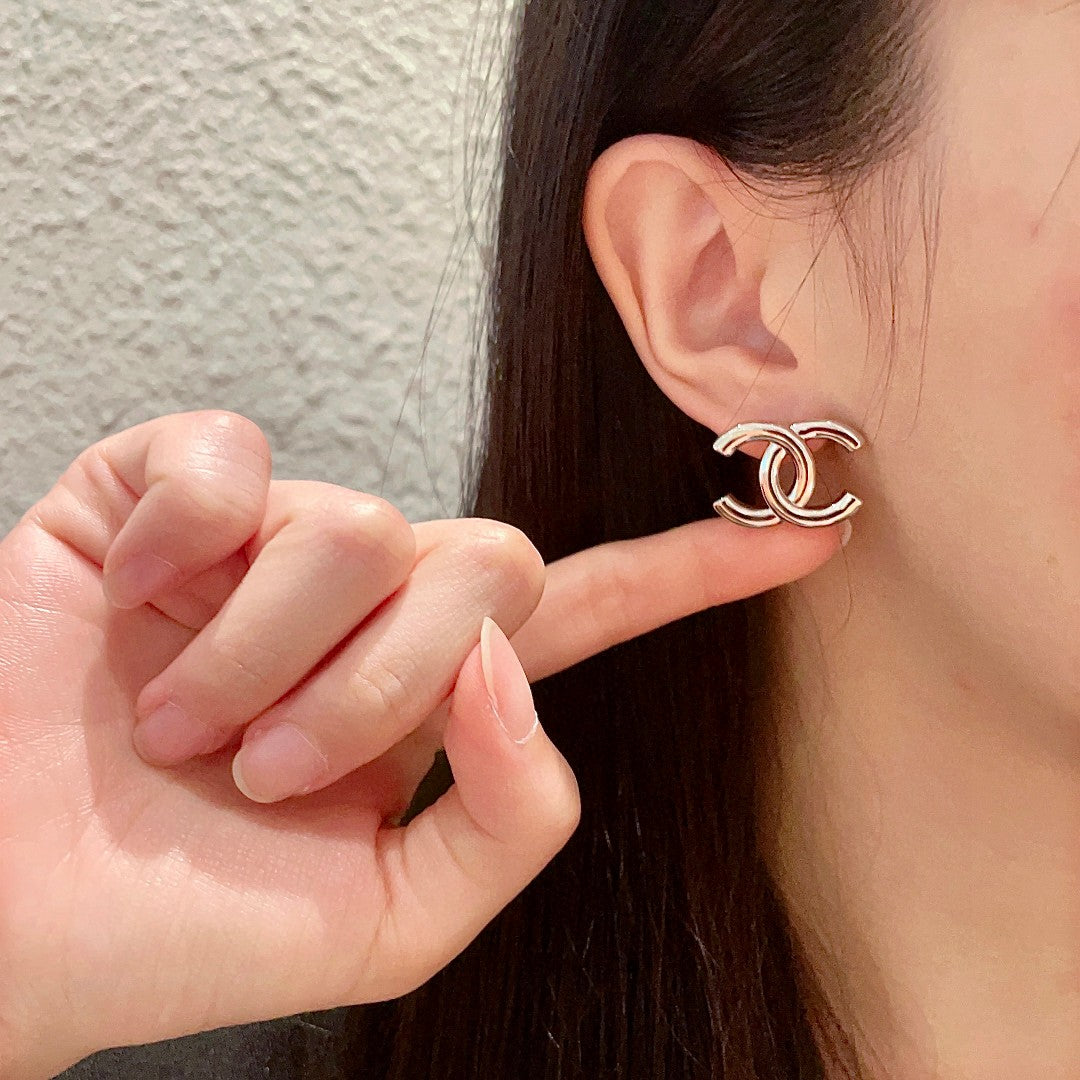Double-C Emblem Stud Earrings in Polished Metal-Tone – Design 264 front product view