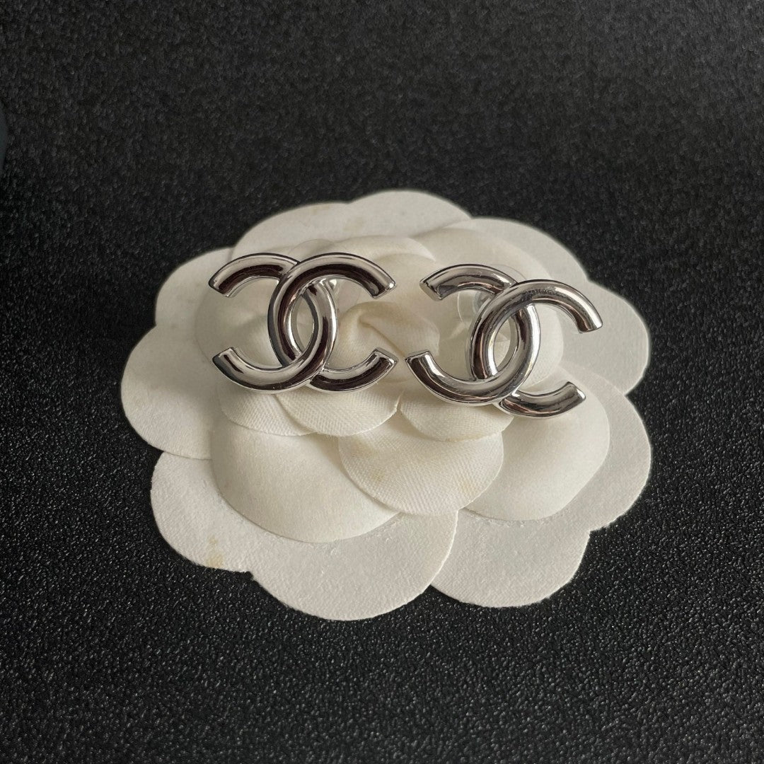 Double-C Emblem Stud Earrings in Polished Metal-Tone – Design 264 front product view