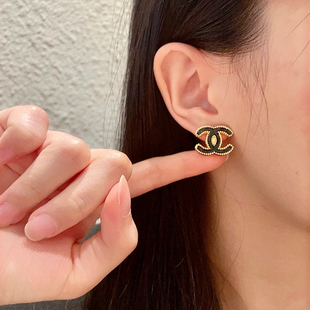 Double-C Emblem Stud Earrings in Polished Metal-Tone – Design 262 front product view