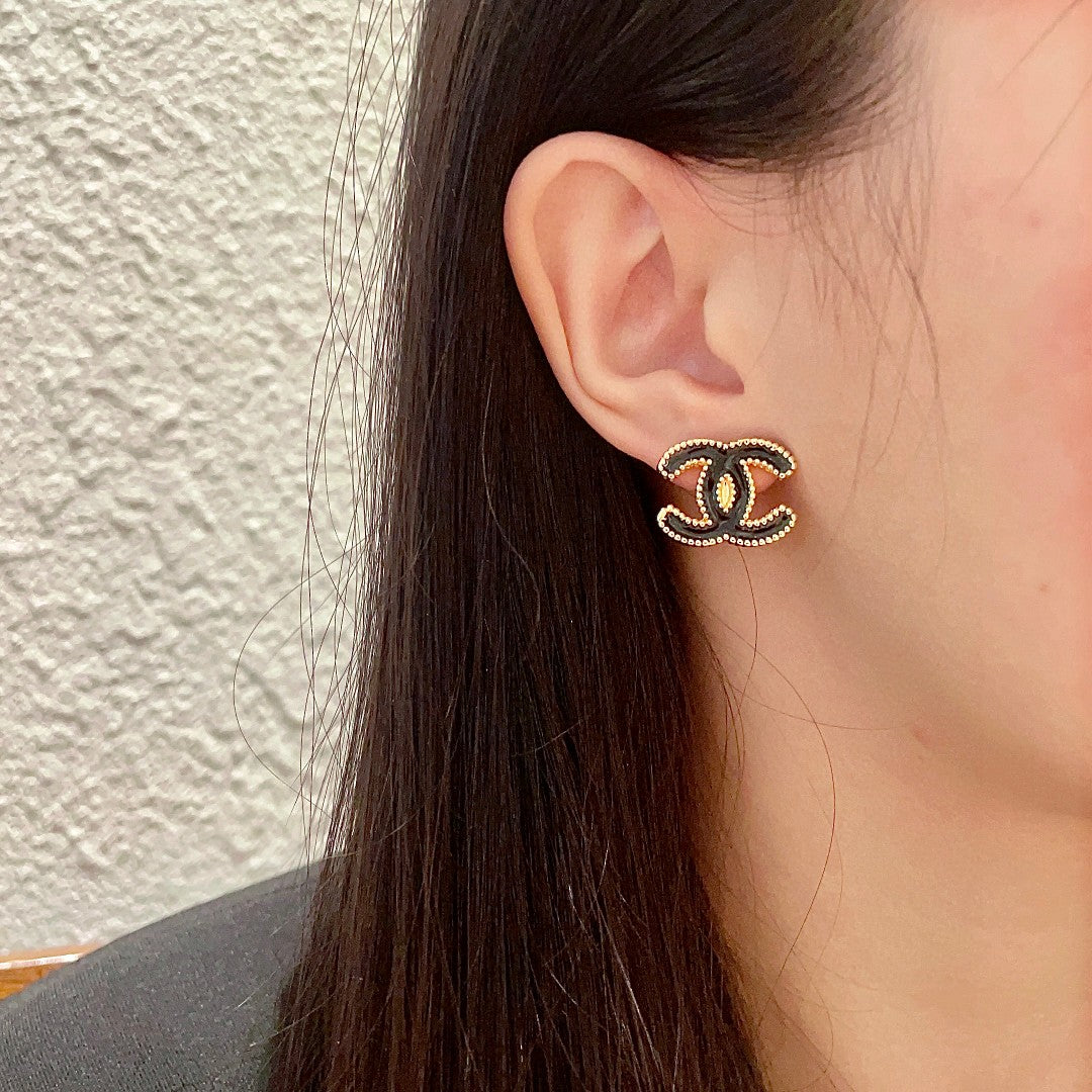 Double-C Emblem Stud Earrings in Polished Metal-Tone – Design 262 detail view