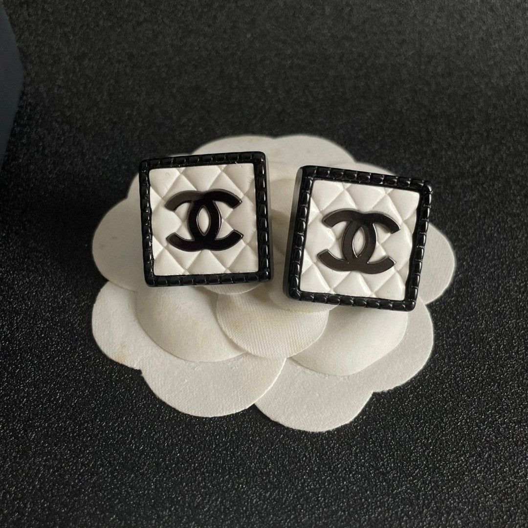 Double-C Emblem Stud Earrings in Polished Metal-Tone – Design 228 front product view