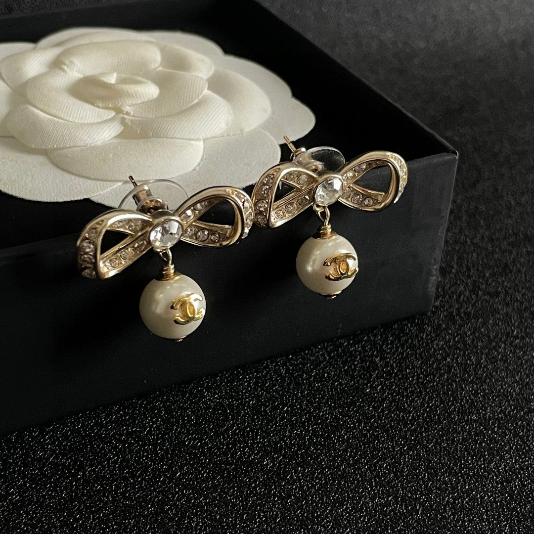 Bow Pearl-Detail Statement Earrings styled product view