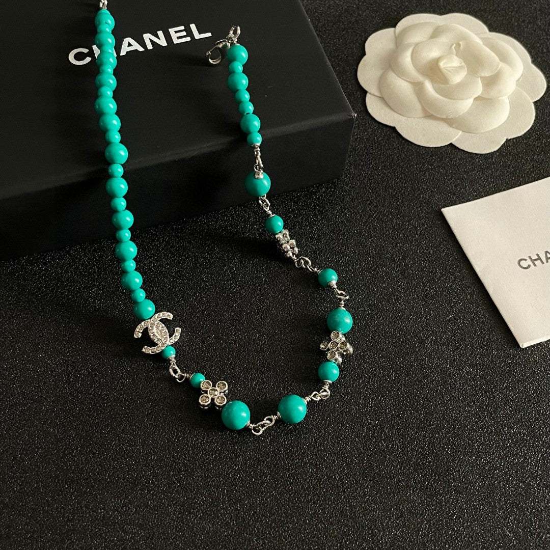 Double-C Emblem Pearl-Detail Pendant Necklace – Pearl Detail – Design 052 styled product view