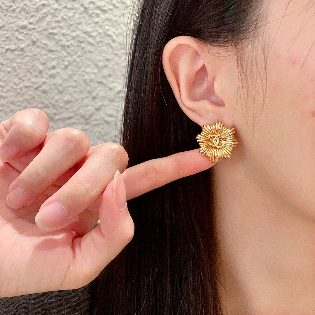 Double-C Emblem Stud Earrings in Polished Metal-Tone – Design 223 front product view