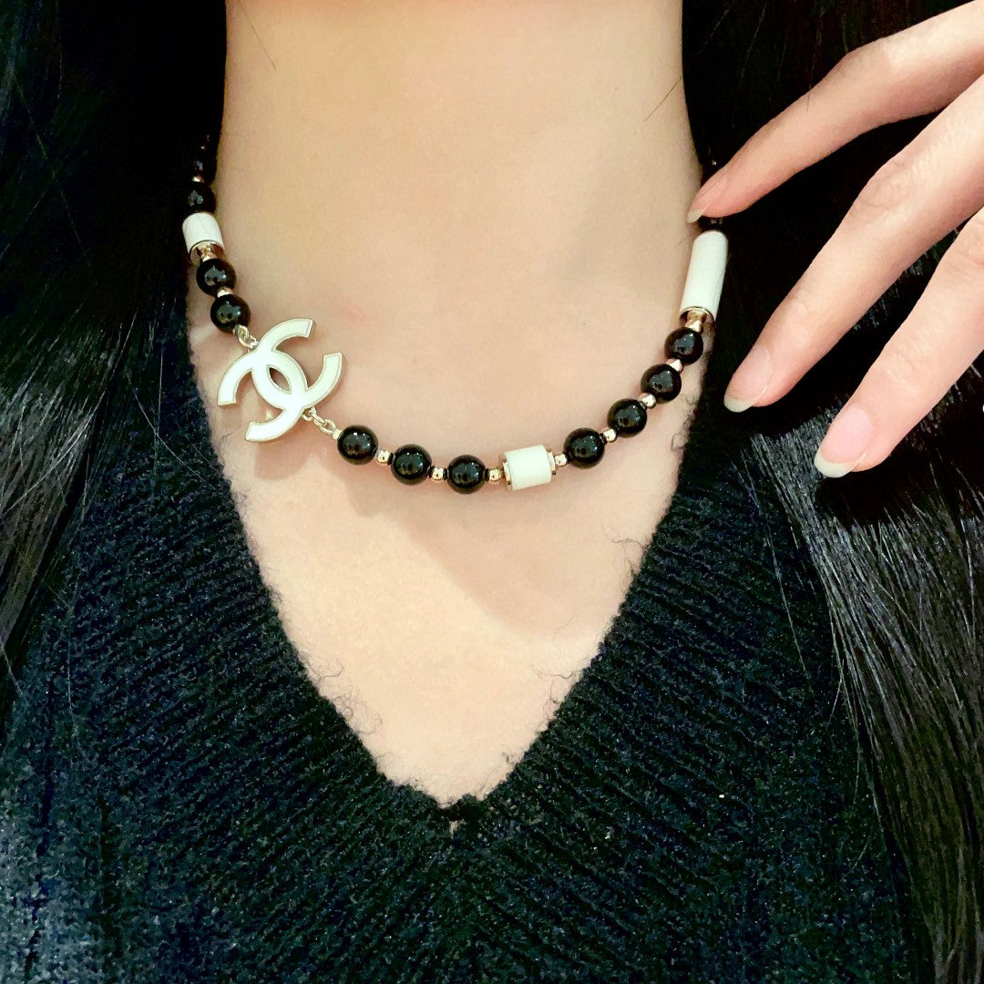 Double-C Emblem Pendant Necklace in Polished Metal-Tone – Black Detail main product view