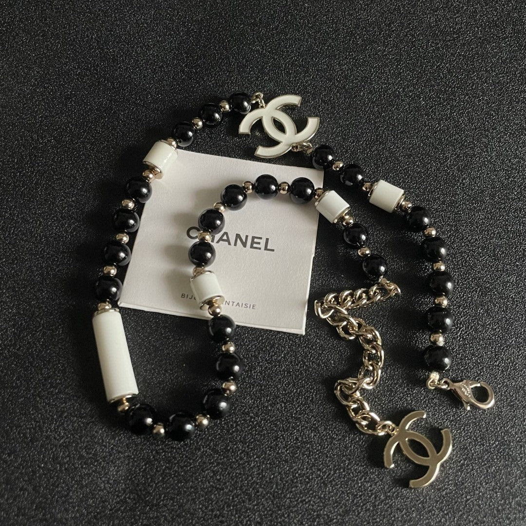 Double-C Emblem Pendant Necklace in Polished Metal-Tone – Black Detail detail view