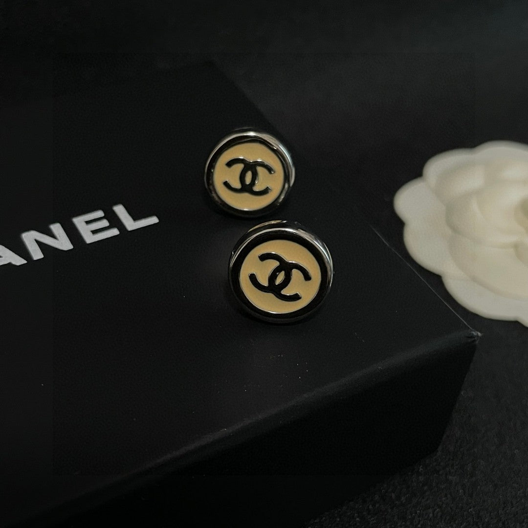 Double-C Emblem Stud Earrings in Polished Metal-Tone – Design 222 detail view