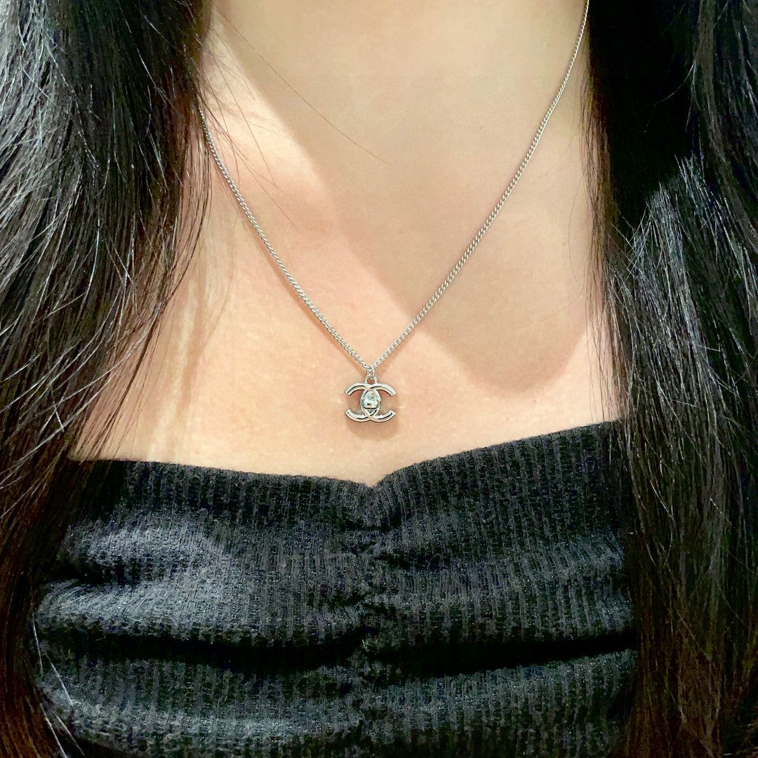 Double-C Emblem Pendant Necklace in Polished Metal-Tone – Design 025 detail view