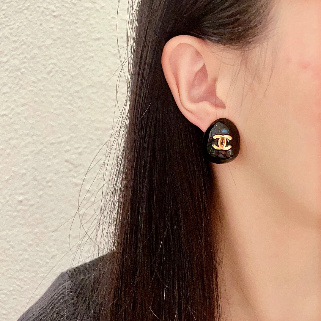 Double-C Emblem Stud Earrings in Polished Metal-Tone – Design 193 detail view