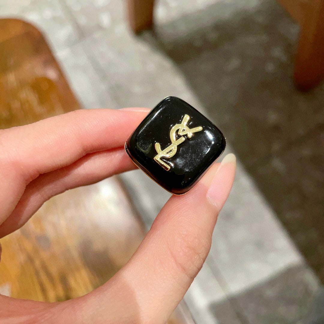 Letter Emblem Statement Ring in Polished Metal-Tone detail view