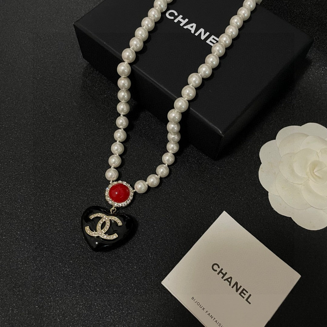 Double-C Emblem Crystal-Accent Pendant Necklace – Heart Detail – Design 002 close-up detail